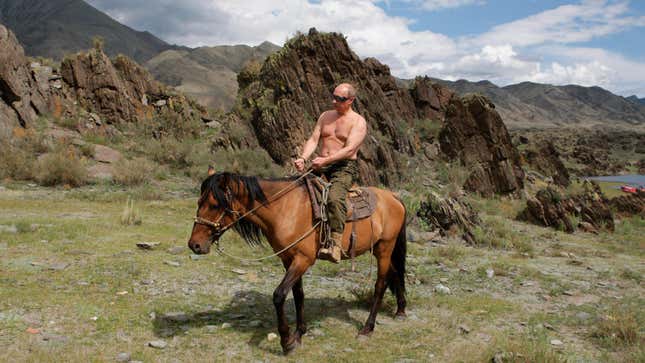 In this file pool photo, then Russian Prime Minister Vladimir Putin is seen riding a horse while traveling in the mountains of the Siberian Tyva region.