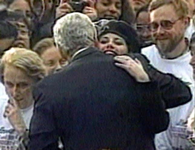 Monica Lewinsky embraces President Clinton as he greeted well-wishers at a White House lawn party in Washington on Nov. 6, 1996.