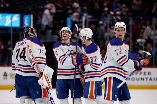 Apr 11, 2023; Denver, Colorado, USA; Edmonton Oilers defenseman Evan Bouchard (2) celebrates with left wing Warren Foegele (37) and goaltender Stuart Skinner (74) and center Nick Bjugstad (72) after the game against the Colorado Avalanche at Ball Arena.