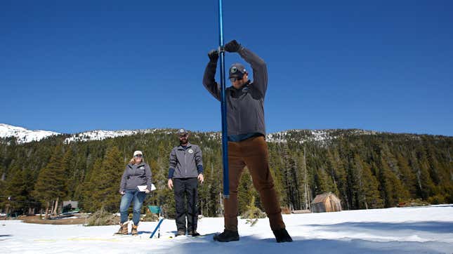 Researchers measuring snow in California last week.