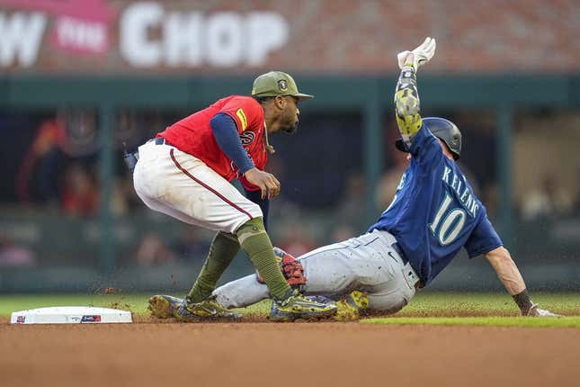 May 19, 2023; Cumberland, Georgia, USA; Seattle Mariners left fielder Jarred Kelenic (10) is tagged out by Atlanta Braves second baseman Ozzie Albies (1) while trying to steal second base during the fourth inning at Truist Park.