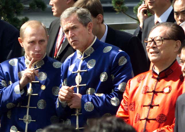 From left, Russian president Vladimir Putin, US president George W. Bush, and Chinese president Jiang Zemin at the Asia-Pacific Economic Cooperation summit in Shanghai in October 2001.