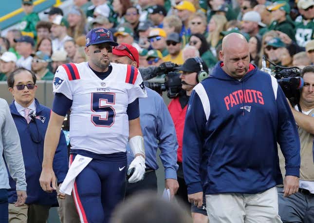 New England Patriots quarterback Brian Hoyer (5) leaves the field in the second quarter against the Green Bay Packers on Sunday, Oct. 2, at Lambeau Field in Green Bay, Wisconsin. He was being evaluated for a head injury.

Mjs Apc Packvspatriots 1002220574djp