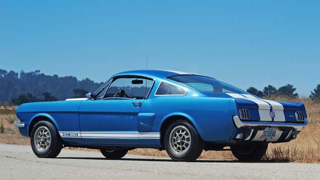 A photo of a pale blue Shelby Mustang. 