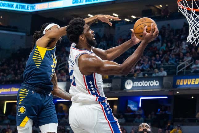 Mar 6, 2023; Indianapolis, Indiana, USA; Philadelphia 76ers center Joel Embiid (21) shoots the ball while Indiana Pacers forward Isaiah Jackson (22) defends in the second quarter at Gainbridge Fieldhouse.