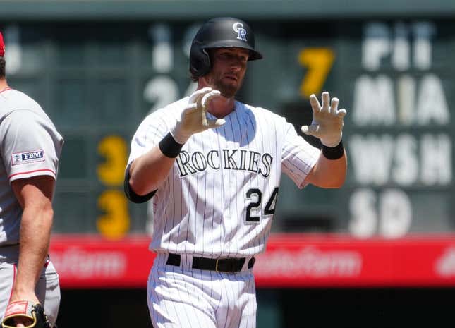 Jun 25, 2023; Denver, Colorado, USA; Colorado Rockies third baseman Ryan McMahon (24) reacts to his single in the first inning against the Los Angeles Angels at Coors Field.