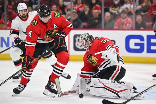 Mar 6, 2023; Chicago, Illinois, USA;  Chicago Blackhawks defenseman Seth Jones (4) and goaltender Alex Stalock (32) follow the puck after a shot on goal from the Ottawa Senators in the first period at United Center.