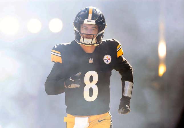 January 8, 2023;  Pittsburgh, Pennsylvania, USA;  Pittsburgh Steelers quarterback Kenny Pickett (8) tackles the Cleveland Browns during the first quarter at Acrisure Stadium.