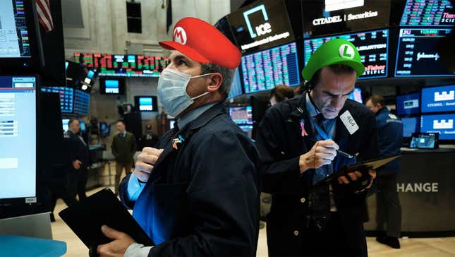 Two Wall Street traders in Mario and Luigi hats look on in terror at another meme stock rollercoaster ride. 