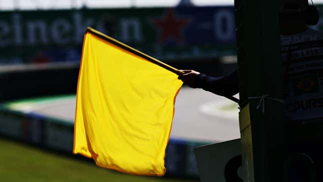 A photo of a yellow flag waving at the Brazilian Grand Prix. 