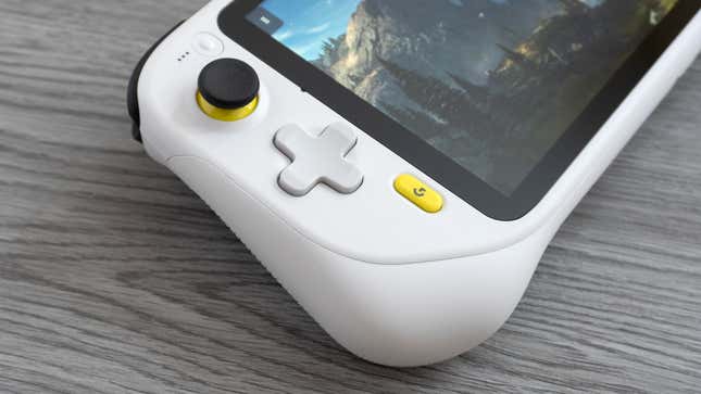 A close up of the left joystick and D-pad on the Logitech G Cloud against a gray wooden background.