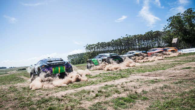 A photo of five Extreme E cars racing off the line.