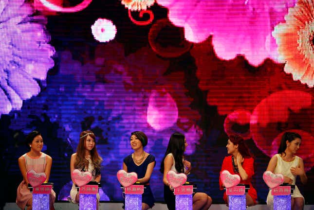 Woman talk during the recording of an episode of a matchmaking television programme, "One out of 100", in Shanghai July 27, 2013.