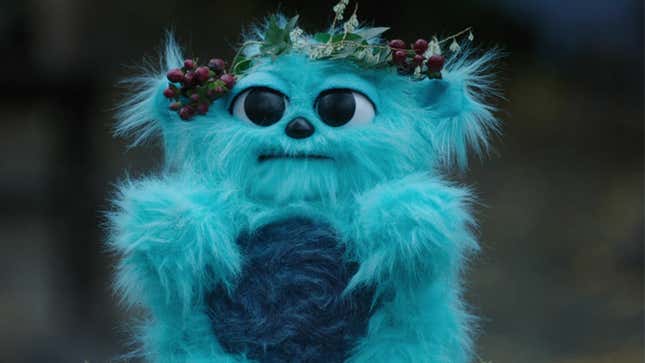 Beebo the furry plush toy/God of War wears a small crown of branches in Legends of Tomorrow.