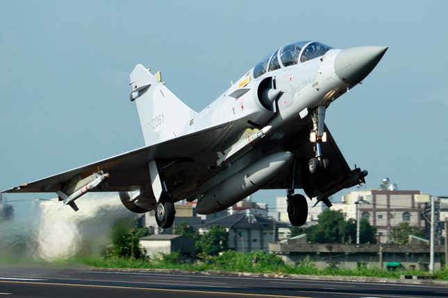 A Taiwan Air Force Mirage 2000 fighter jet land takes off from a closed section of highway.