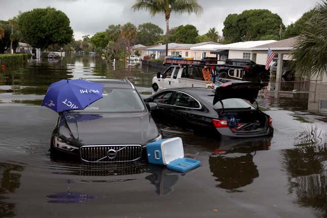 Abandoned vehicles sit in a flooded street on April 13, 2023 in Fort Lauderdale, Florida.