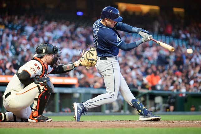 Aug 14, 2023; San Francisco, California, USA; Tampa Bay Rays infielder Curtis Mead (25) hits an infield single against the San Francisco Giants during the fifth inning at Oracle Park.