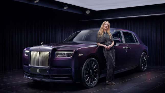 A photo of Iris van Verpen stood next to the Rolls Royce Phantom Syntopia. 