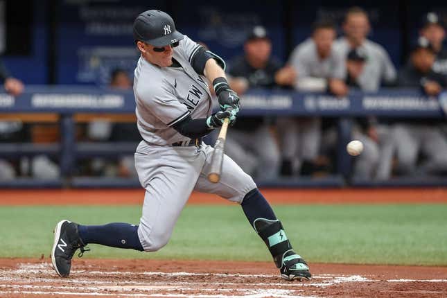 May 7, 2023; St. Petersburg, Florida, USA;  New York Yankees center fielder Harrison Bader (22) hits a tw0 run home run against the Tampa Bay Rays in the third inning at Tropicana Field.