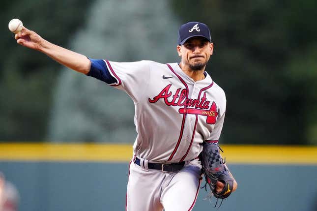 Aug 29, 2023; Denver, Colorado, USA; Atlanta Braves starting pitcher Charlie Morton (50) delivers a pitch in the first inning against the Colorado Rockies at Coors Field.