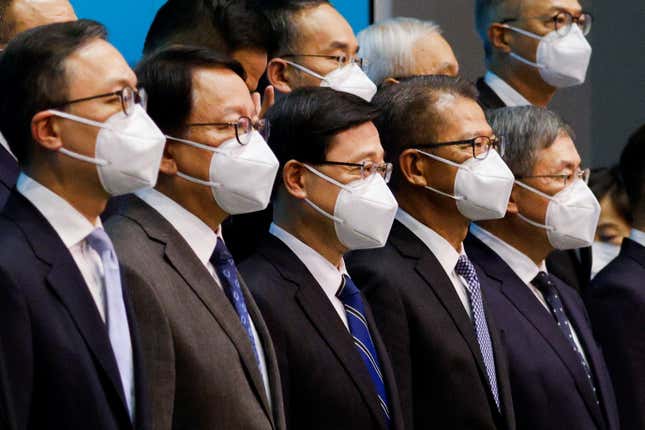 Hong Kong Chief Executive-designate John Lee attends a news conference with his newly appointed cabinet.