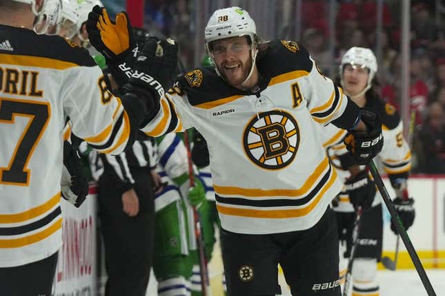 Mar 26, 2023; Raleigh, North Carolina, USA;  Boston Bruins right wing David Pastrnak (88) celebrates his goal against the Carolina Hurricanes during the first period at PNC Arena.
