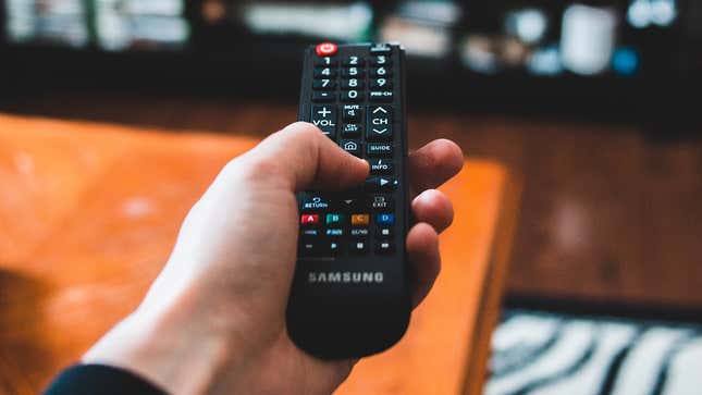 hand holding a remote