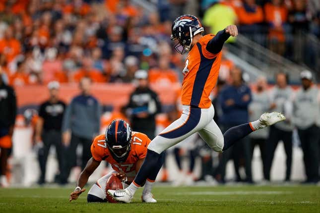 Oct 6, 2022; Denver, Colorado, USA; Denver Broncos place kicker Brandon McManus (8) kicks a field goal on a hold from punter Corliss Waitman (17) in the first quarter against the Indianapolis Colts at Empower Field at Mile High.