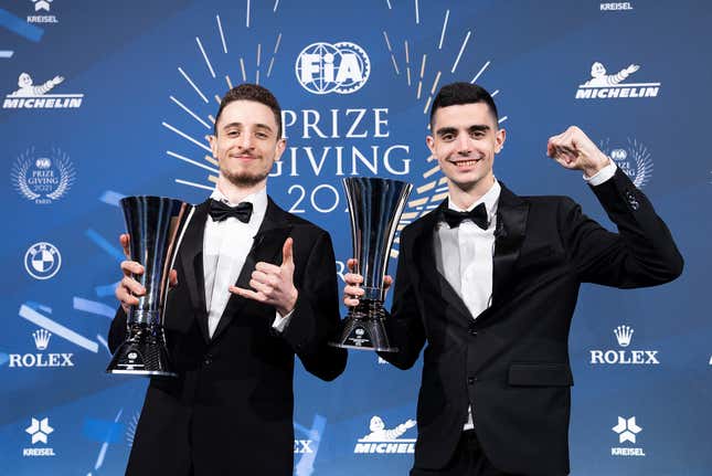 2021 Nations Cup champions Valerio Gallo (left) and Coque López hold their Manufacturer Series trophies at the FIA Prize-Giving Ceremony in December.