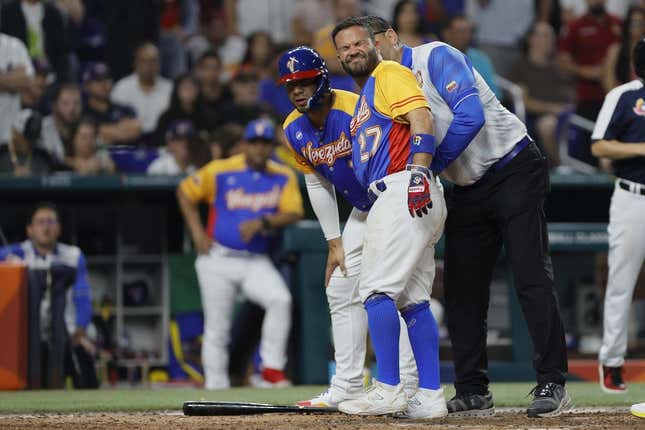 Mar 18, 2023; Miami, Florida, USA; Venezuela second baseman Jose Altuve (27) reacts after getting hit by a pitch during the fifth inning against the USA at LoanDepot Park.