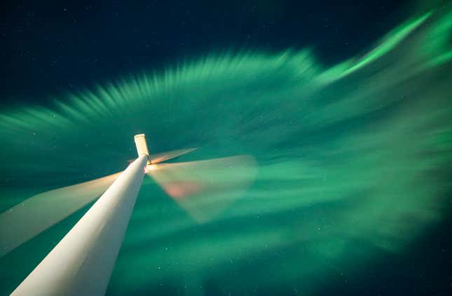 The aurora seen over a wind turbine in Finland.