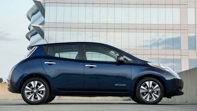 A photo of a dark blue Nissan leaf electric car.