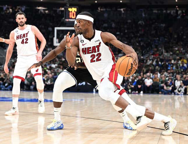 Apr 16, 2023; Milwaukee, Wisconsin, USA; Miami Heat forward Jimmy Butler (22) drives to the basket against Milwaukee Bucks guard Jrue Holiday (21) in the first half during game one of the 2023 NBA Playoffs at Fiserv Forum.