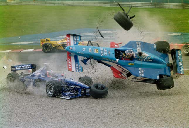Alexander Wurz of Austria driving the No. 6 Mild Seven Benetton Playlife Benetton B198 Playlife V10 overturns in the gravel trap during a crash with Jarno Trulli in the No. 12 Gauloises Prost Peugeot Prost AP01 Peugeot V10 at the start of the 1998 Canadian Grand Prix.
