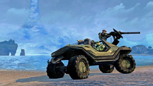 Master Chief drives a warthog on a beach in Halo.