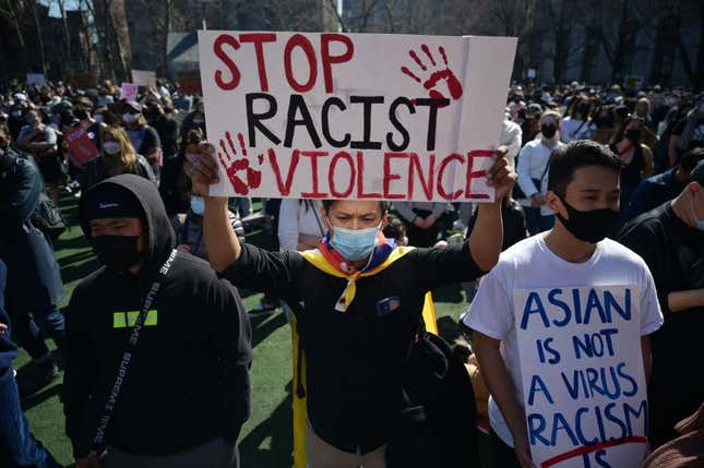 Members and supporters of the Asian-American community attend a “rally against hate” at Columbus Park in New York City on March 21, 2021.