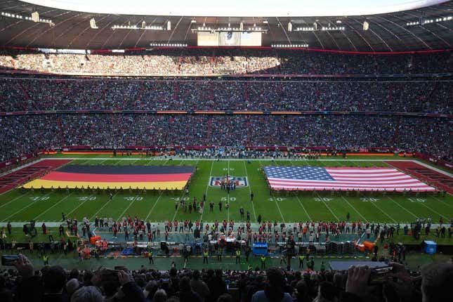 Nov 13, 2022; Munich, Germany; A general overall view of German and United States flags on the field during the playing of the national anthem before an NFL International Series game between the Tampa Bay Buccaneers and the Seattle Seahawks at Allianz Arena.