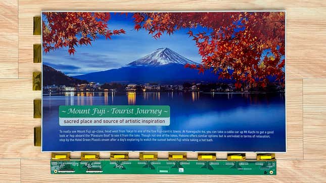 A sample of E Ink's Spectra 6 e-paper panel displaying a colorful image of Mount Fuji with trees in the foreground.