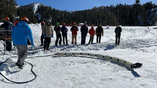 Team members testing out the snake robot named EELS at a ski resort in Southern California in February.