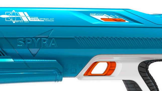 A close-up of a blue SpyraThree water blaster's Game Modes switch against a white background.