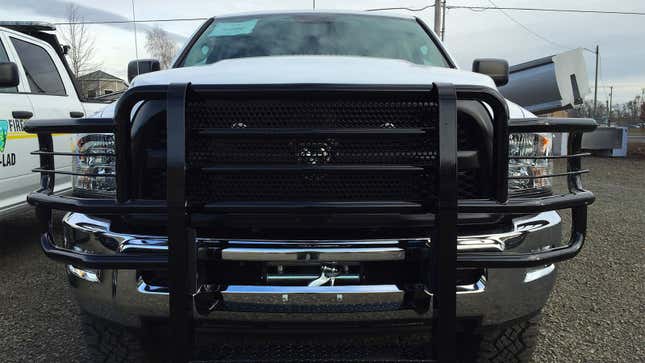 A truck with a black brush guard on the front. 