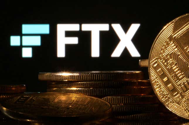 Representations of cryptocurrencies are seen in front of displayed FTX logo in this illustration taken November 10, 2022. 