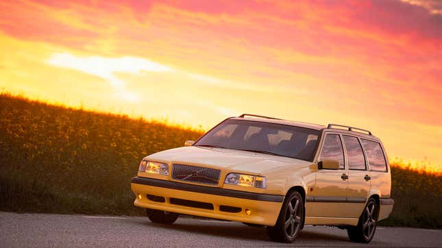 A photo of a yellow Volvo 850R station wagon at sunset. 