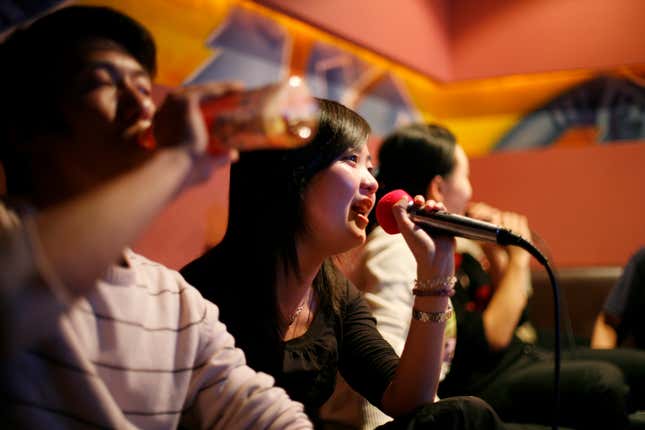 A group of friends sing in a karaoke club during a night out in Shanghai in 2008. Nir Elias/Reuters