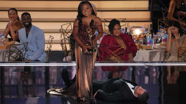 Quinta Brunson accepts the Outstanding Writing for a Comedy Series award for ‘Abbott Elementary’ from (lying on the stage) onstage during the 74th Primetime Emmys at Microsoft Theater on September 12, 2022, in Los Angeles, California