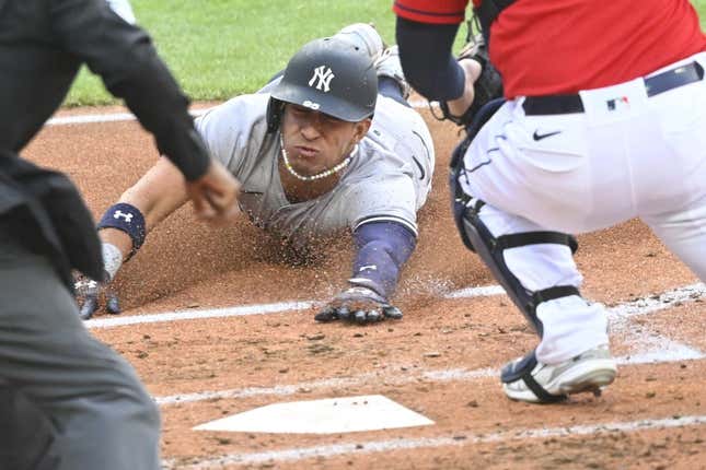 Apr 11, 2023; Cleveland, Ohio, USA; New York Yankees shortstop Oswaldo Cabrera (95) scores in the second inning against the Cleveland Guardians at Progressive Field.