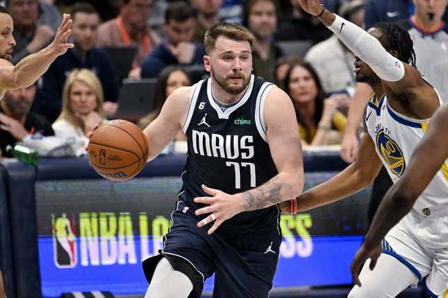 Mar 22, 2023; Dallas, Texas, USA; Dallas Mavericks guard Luka Doncic (77) drives to the basket against the Golden State Warriors during the second half at the American Airlines Center.