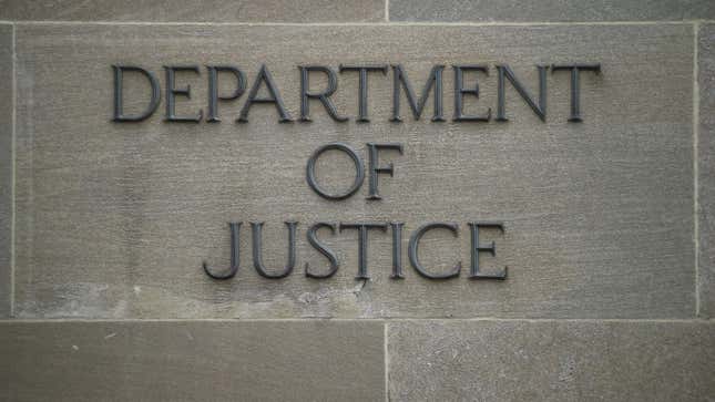 A “Department of Justice” sign is seen on the wall of the US Department of Justice building in Washington, DC on April 18, 2019.