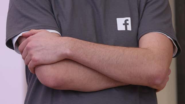 File photo of a Facebook employee wearing a t-shirt with a Facebook logo