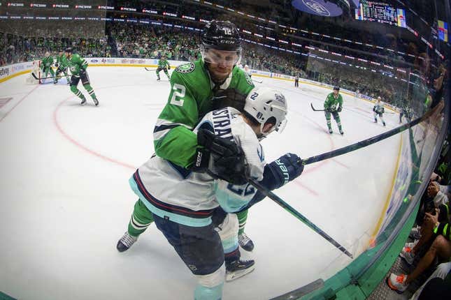 May 11, 2023; Dallas, Texas, USA; Dallas Stars center Radek Faksa (12) ties up Seattle Kraken right wing Oliver Bjorkstrand (22) in the Stars zone during the third period in game five of the second round of the 2023 Stanley Cup Playoffs at American Airlines Center.